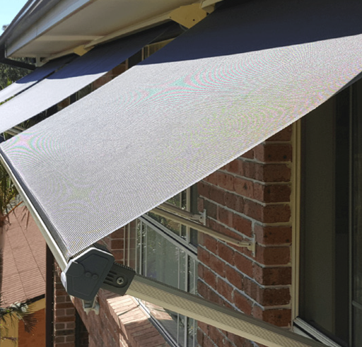 Close-up of a drop arm awning fabric and arm mechanism