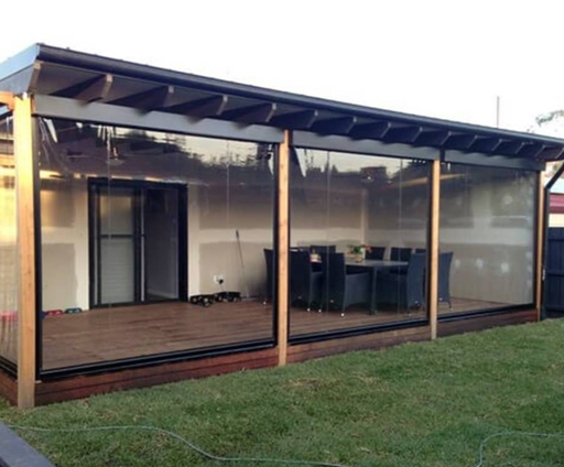 Zipscreen PVC panels enclosing a timber deck alfresco with dining setting