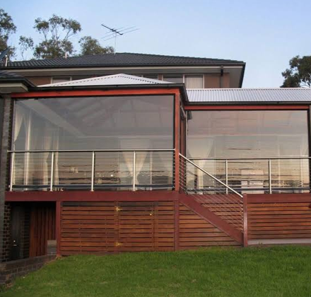Zipscreen PVC panels enclosing a two-storey timber deck