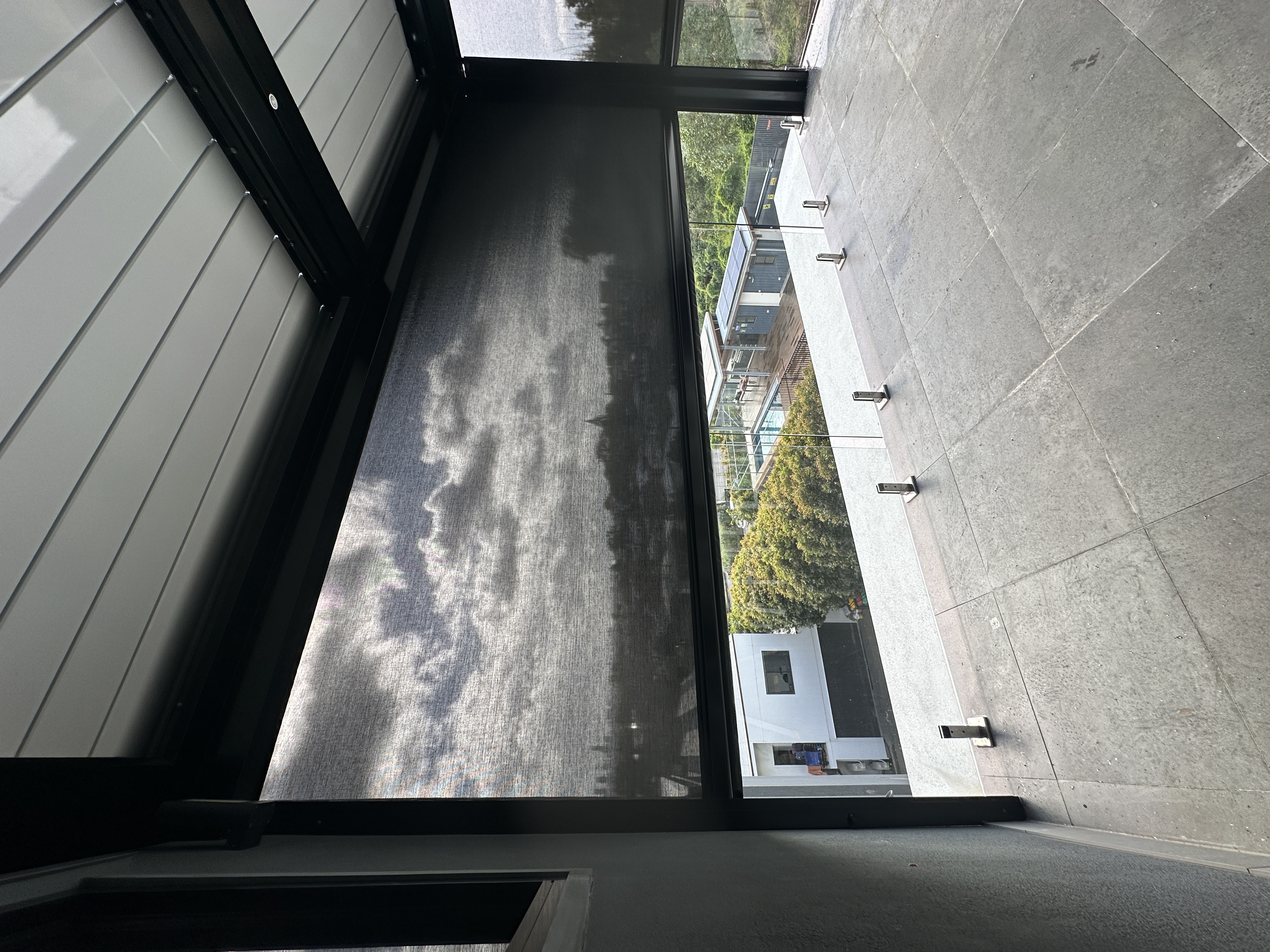 Zipscreen outdoor blind installed on a covered patio