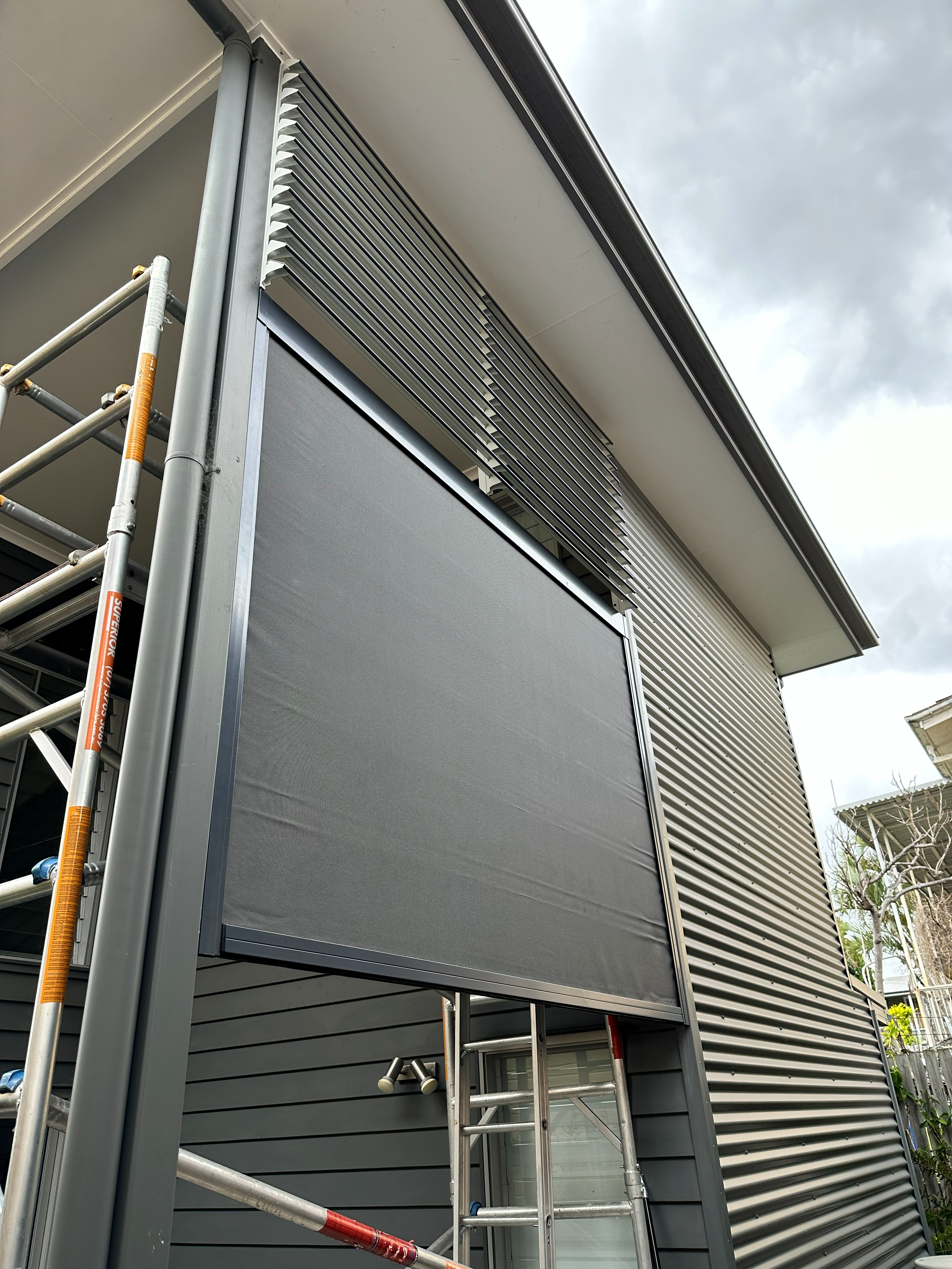 Zipscreen outdoor blind being installed on site