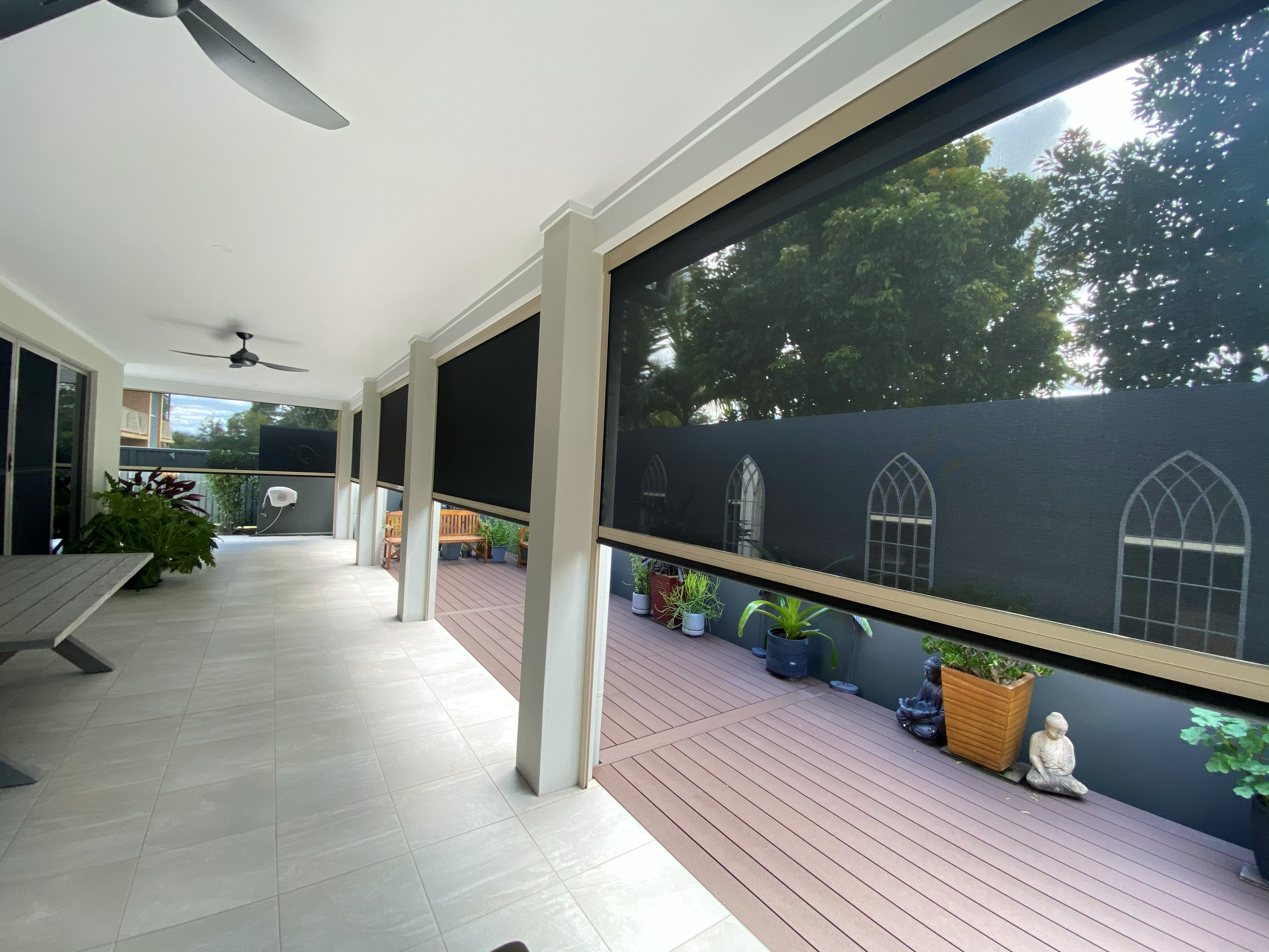 Zipscreen outdoor blinds fitted along a covered outdoor entertaining area