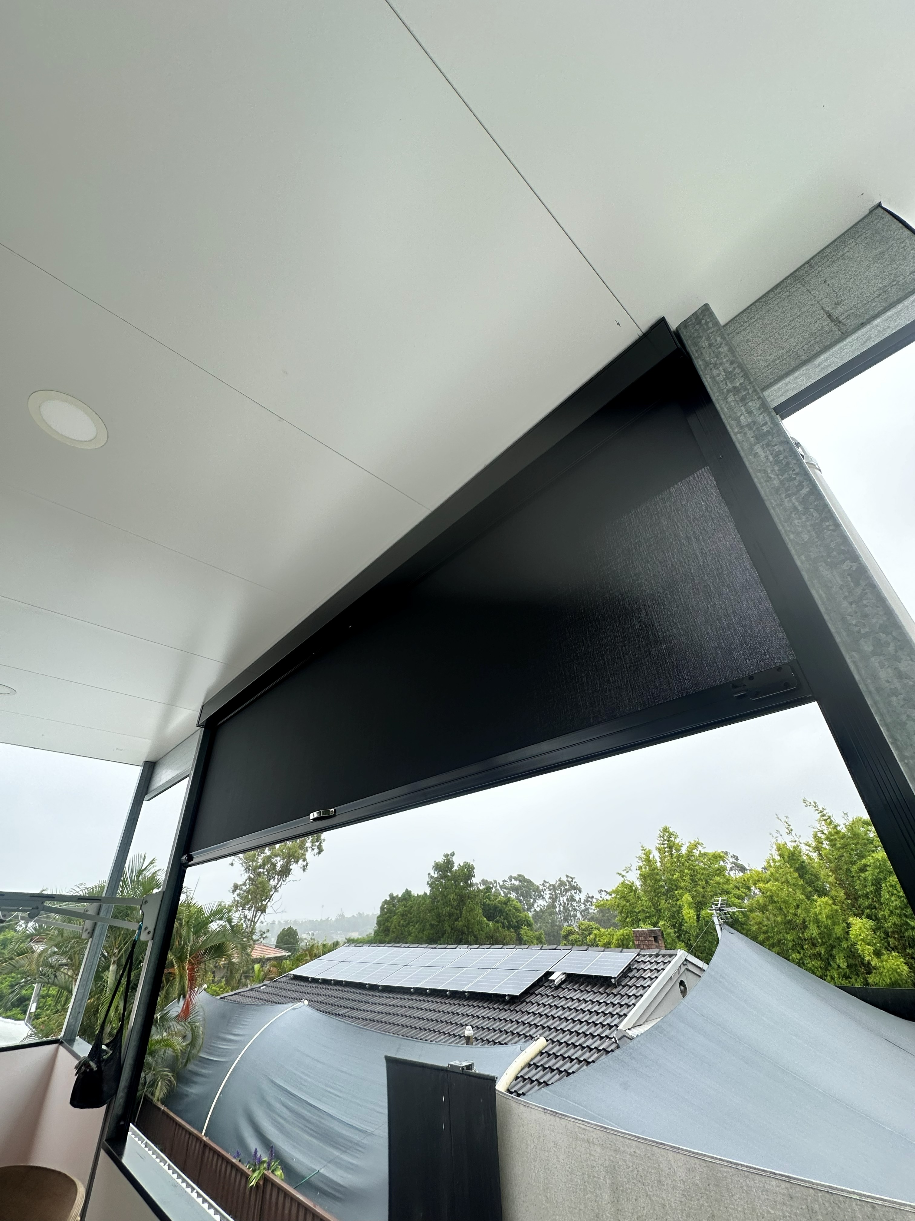 Zipscreen outdoor blind close-up showing mesh fabric and housing